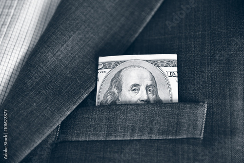 Dollars in the pocket of his jacket (corruption, lobbying, bribe