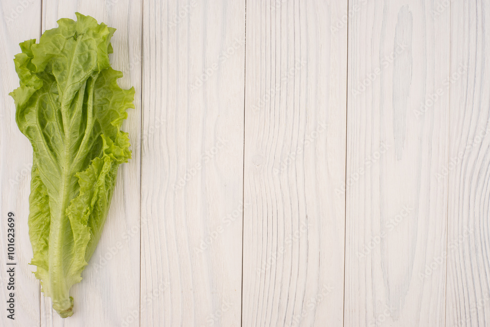 Fresh salad on wooden table