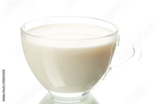 Transparent Cup of milk on white background.