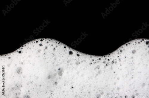 Foam bubbles abstract black background. photo