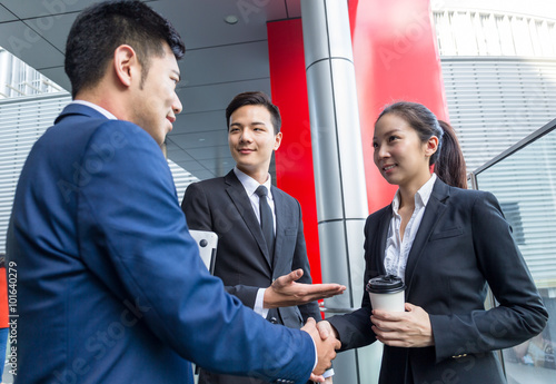 Business assistant introduce his new partner photo