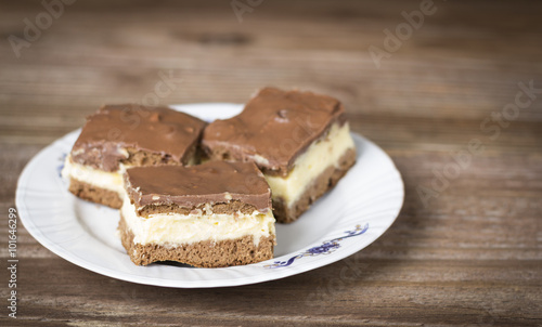 Wallpaper Mural Chocolate cakes in a plate on wooden background Torontodigital.ca