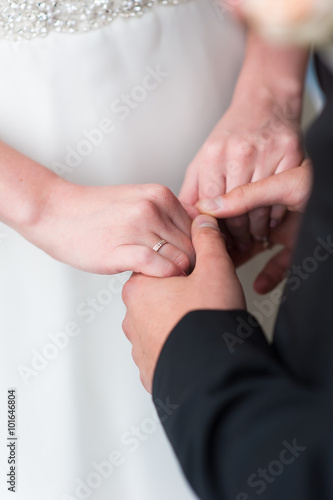 Bride and groom holds hands