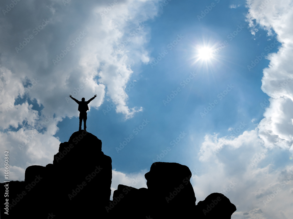 Happy man standing at mountain top Happy man standing at mountain top