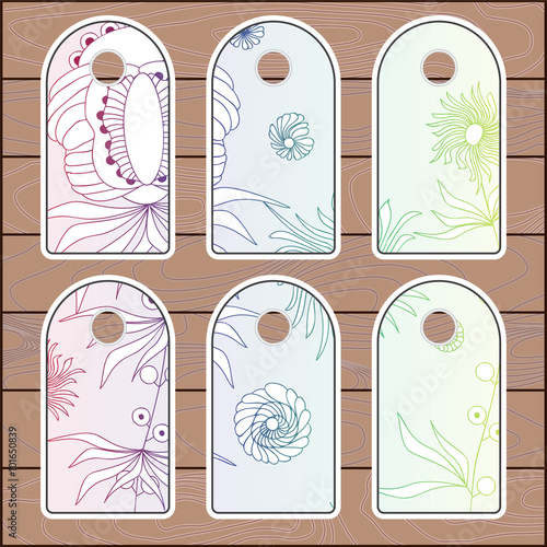 stock vector set of label with floral pattern on the wood backgr