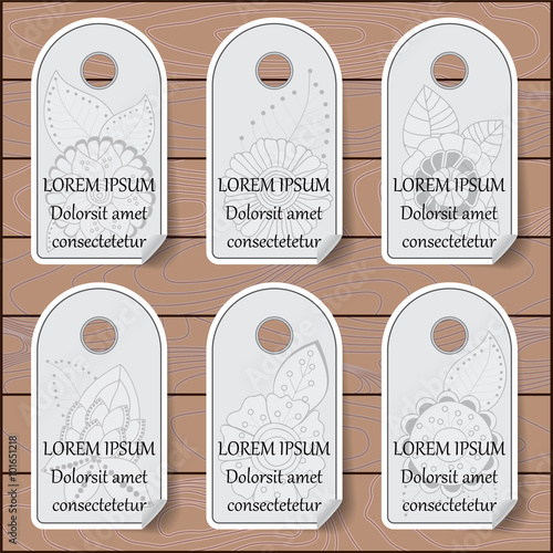 stock vector set of label with floral pattern on the wood backgr