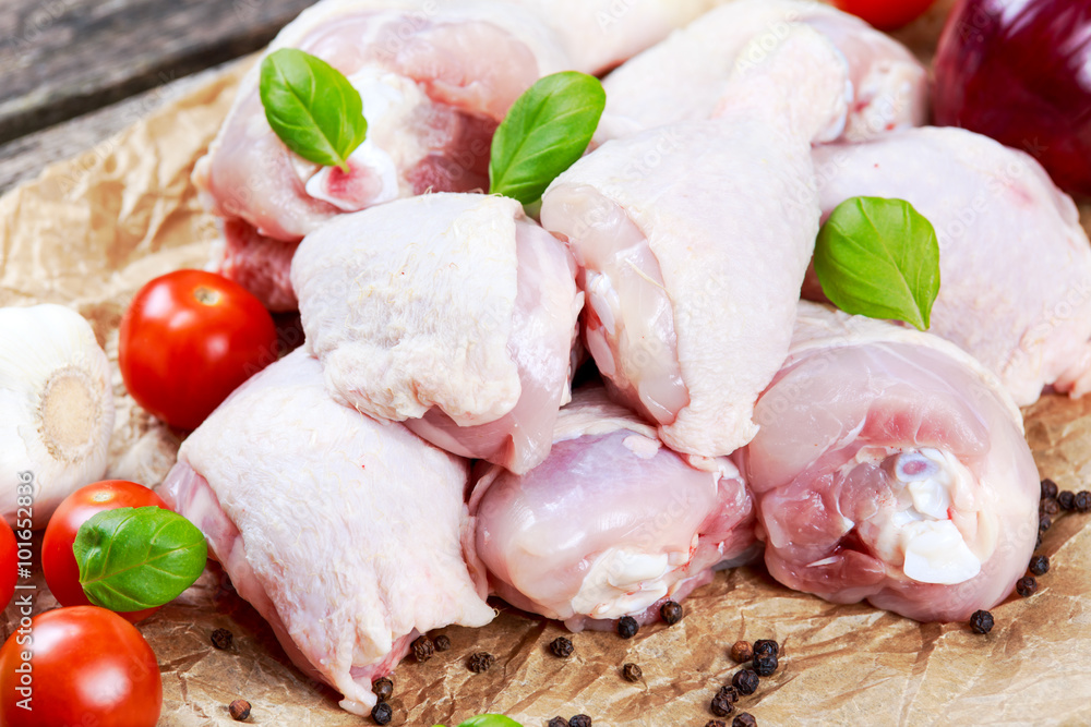 Raw Chicken Drumsticks with basil and pepper, salt, vegetables Raw Chicken Drumsticks with basil and pepper, salt, vegetables