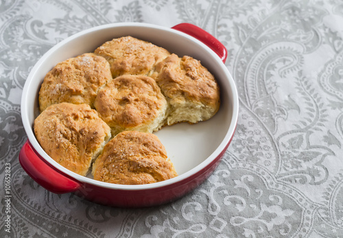 Simple scones in the baking dish on a gray background
