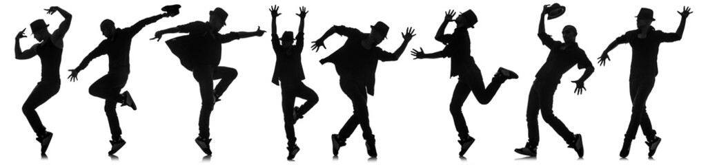 Silhouettes of dancers in dancing concept
