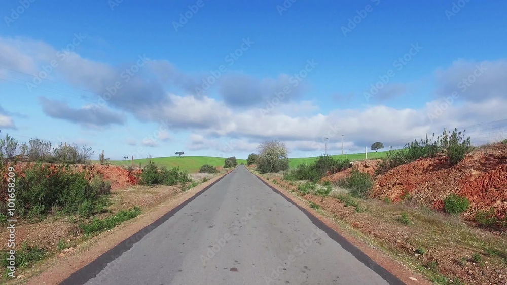 Speedy Driving on a Road in Countryside Speedy Driving on a Road in Countryside