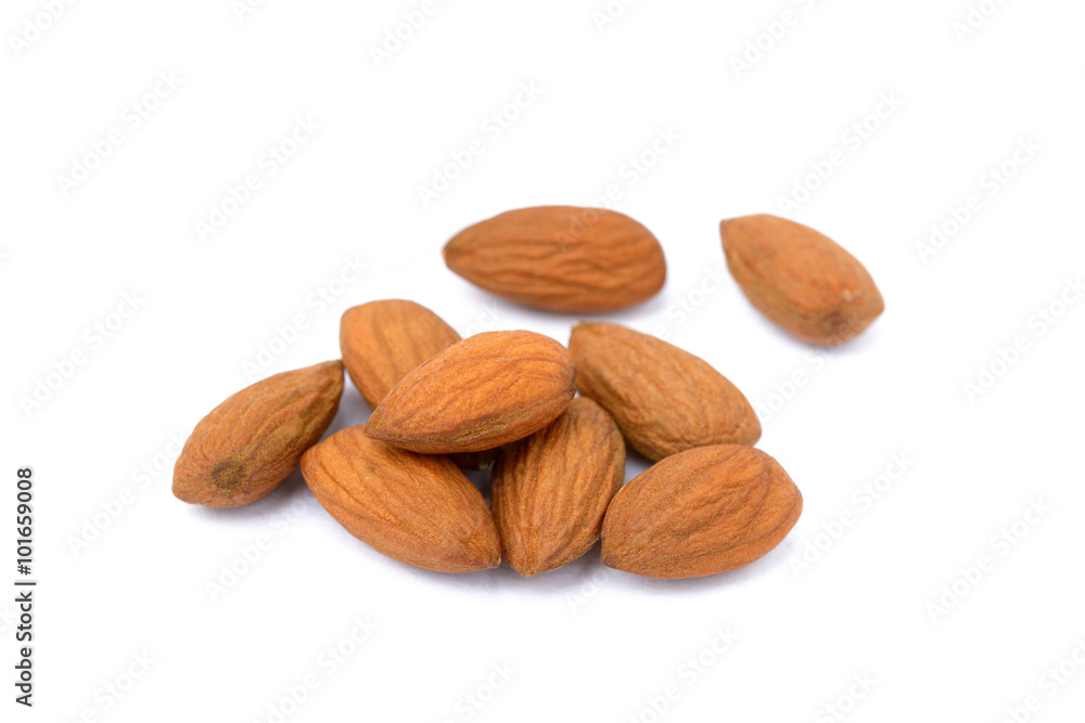 Group unpeeled almonds isolated on white background