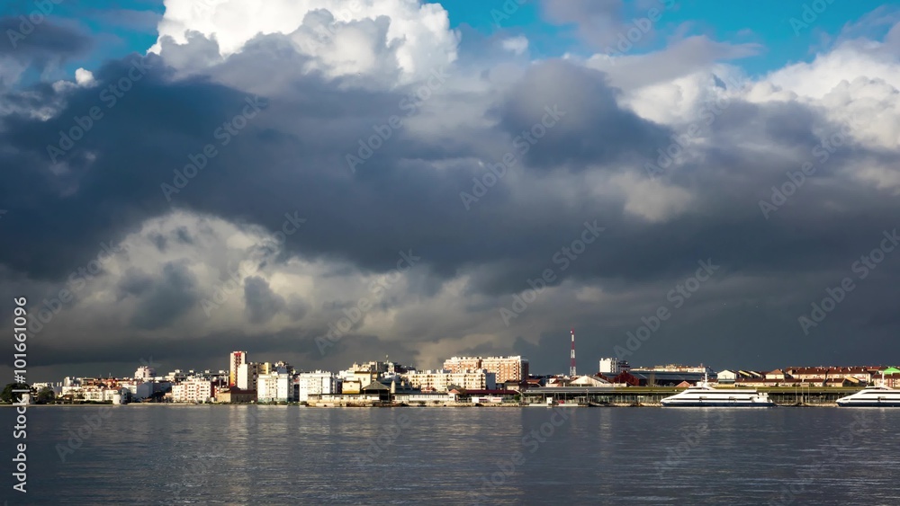 Fluffy Clouds over City and Ferry Terminal Fluffy Clouds over City and Ferry Terminal