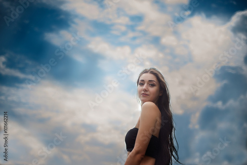 girl standing outdoors against the sky