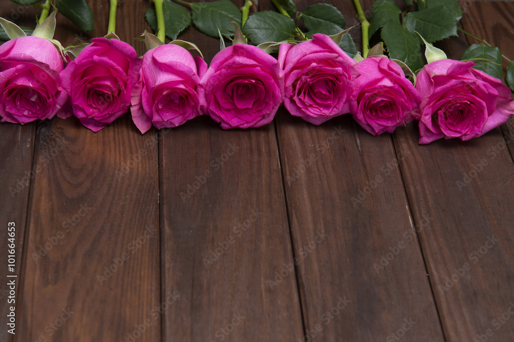 beautiful fresh roses on wooden background beautiful fresh roses on wooden background
