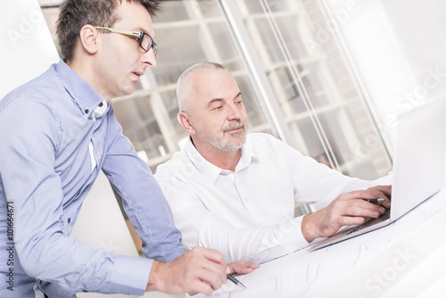 Business People Meeting Communication Discussion Working Office Concept. Focus on man sitting on the right