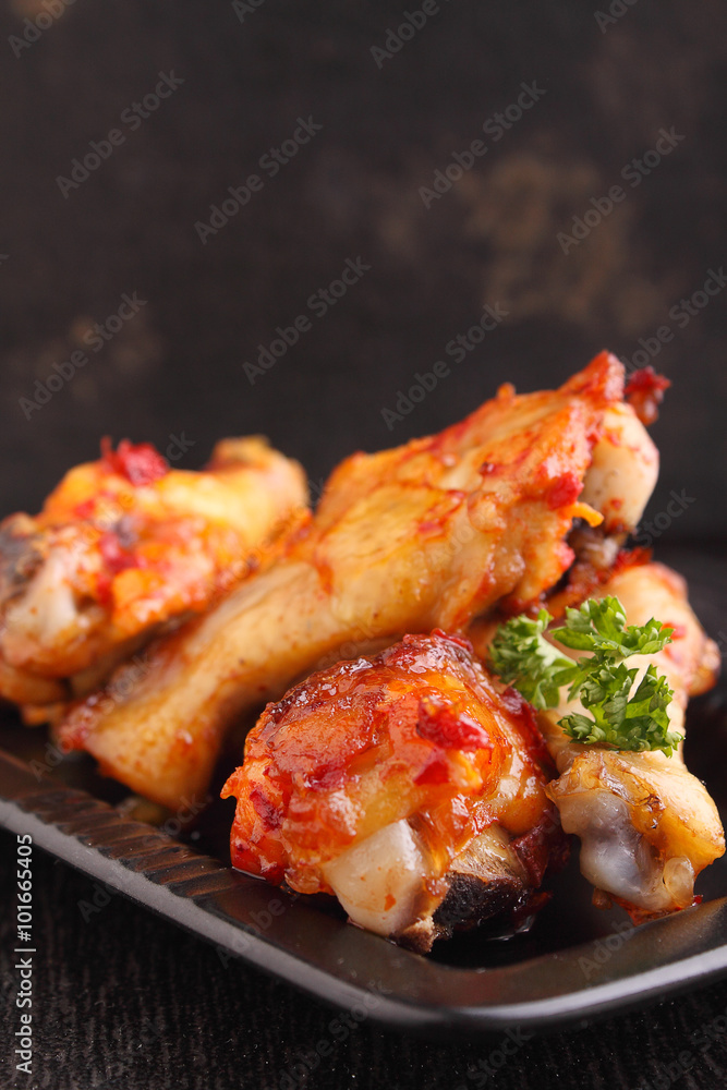 Chicken wings fried with spices in tomato sauce Chicken wings fried with spices in tomato sauce