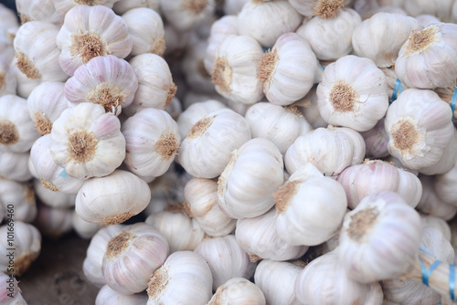 Closeup on garlic in sacks at market