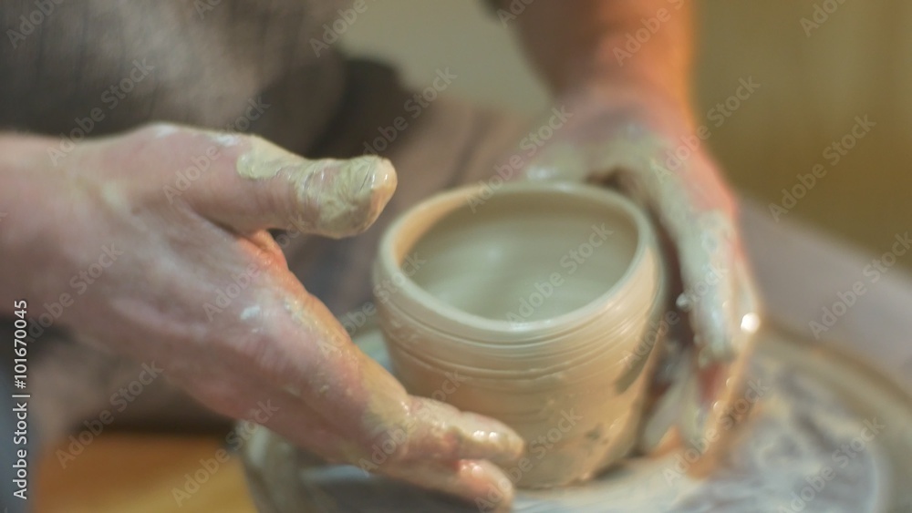 Man is Taking A Raw Clay Pot Off A Wheel Holding a Pot Talking Dirty Hands Close Up Molding a Clay Pot Working on a Pottery Wheel Pottery Workshop Man is Taking A Raw Clay Pot Off A Wheel Holding a Pot Talking Dirty Hands Close Up Molding a Clay Pot Working on a Pottery Wheel Pottery Workshop