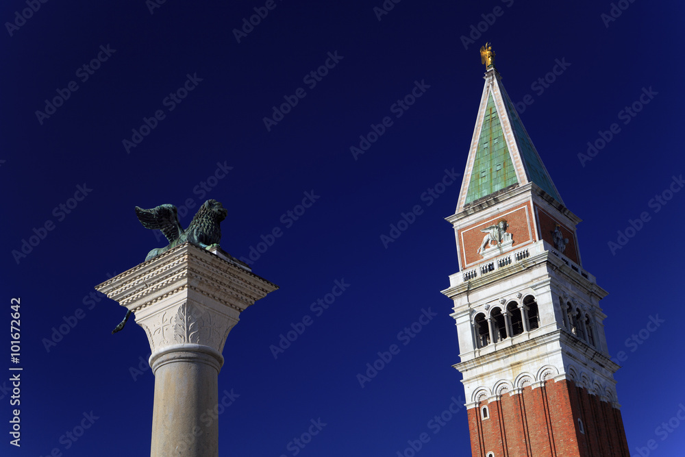 Tower of St. Marks Campanile and the statue of Lion of Venice