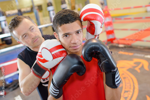 Young man with boxing instructor © auremar