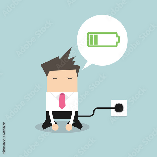 Businessman feeling tired and charging battery.