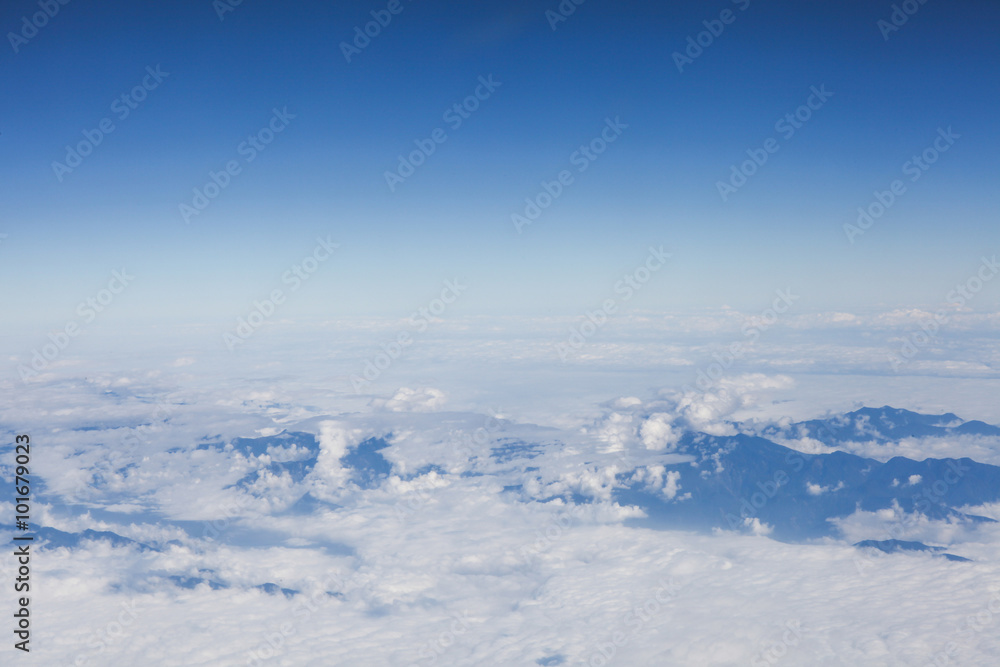 Skyline View above the Clouds from Airplane