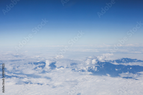 Skyline View above the Clouds from Airplane © twinsterphoto