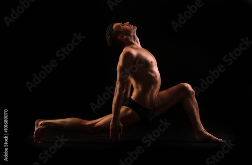 young man doing yoga and gymnastics,
 deep lunge leg