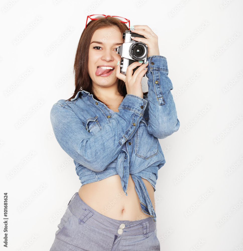 young pretty woman holding camera young pretty woman holding camera
