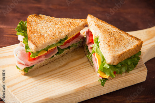 Sandwich bread tomato, lettuce, onion and yellow cheese
