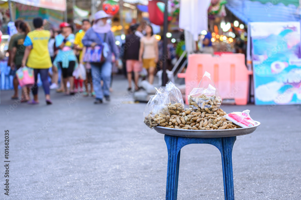Boiled peanuts are selling at walking street market in Asian city.