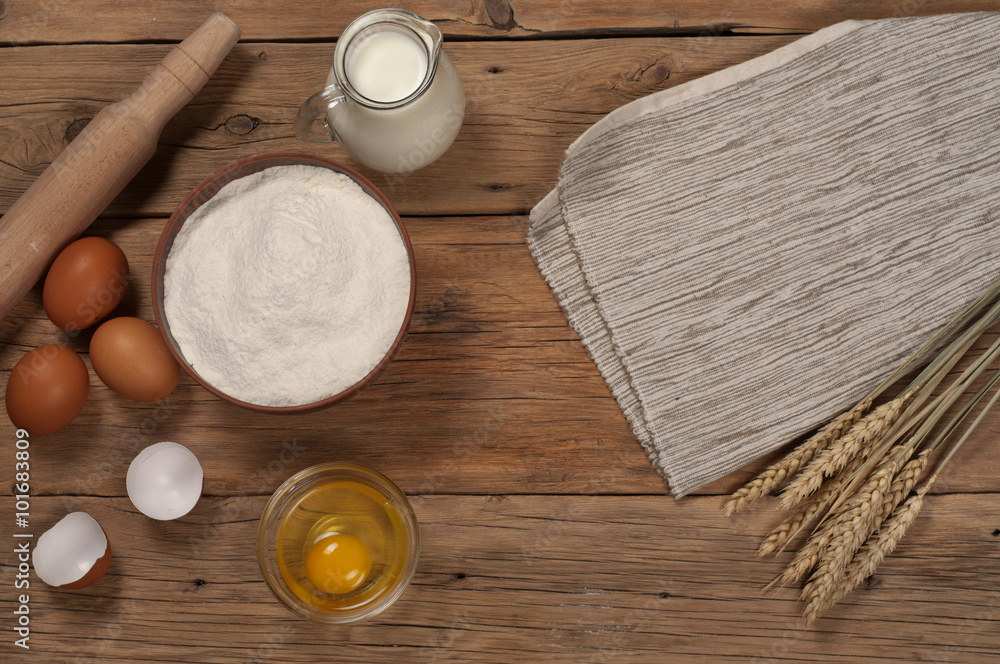 bowl flour with ears of wheat, eggs and milk bowl flour with ears of wheat, eggs and milk