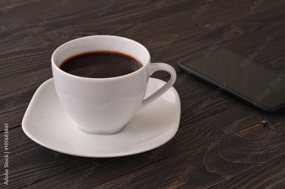 Coffee American with a smartphone Coffee American with a smartphone