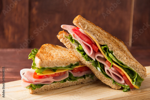 Sandwich bread tomato, lettuce and yellow cheese photo