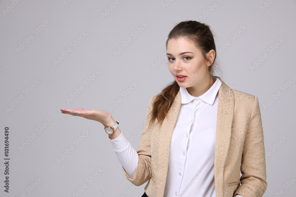 smiling young business woman showing blank area smiling young business woman showing blank area