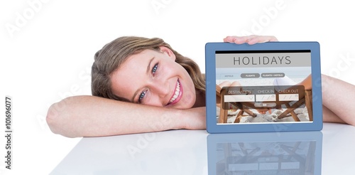 Composite image of woman showing tablet pc 