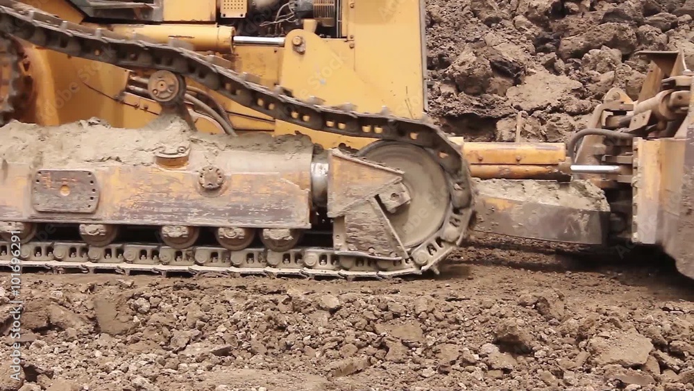 Bulldozer machine is leveling construction site.
Earthmover with caterpillar is moving earth outdoors.
Bulldozer machine is leveling construction site.
Earthmover with caterpillar is moving earth outdoors.