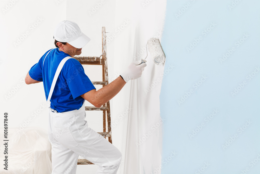 painter painting with paint roller