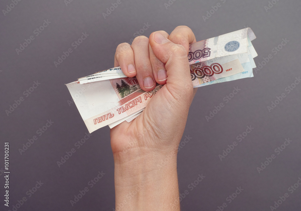 Εκτύπωση καμβά Woman hand squeezes russian money