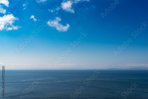 Seascape with blue sky and clouds.