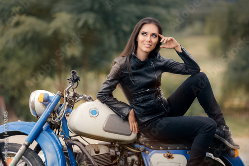 Biker Girl in Leather Jacket on Retro Motorcycle © nicoletaionescu