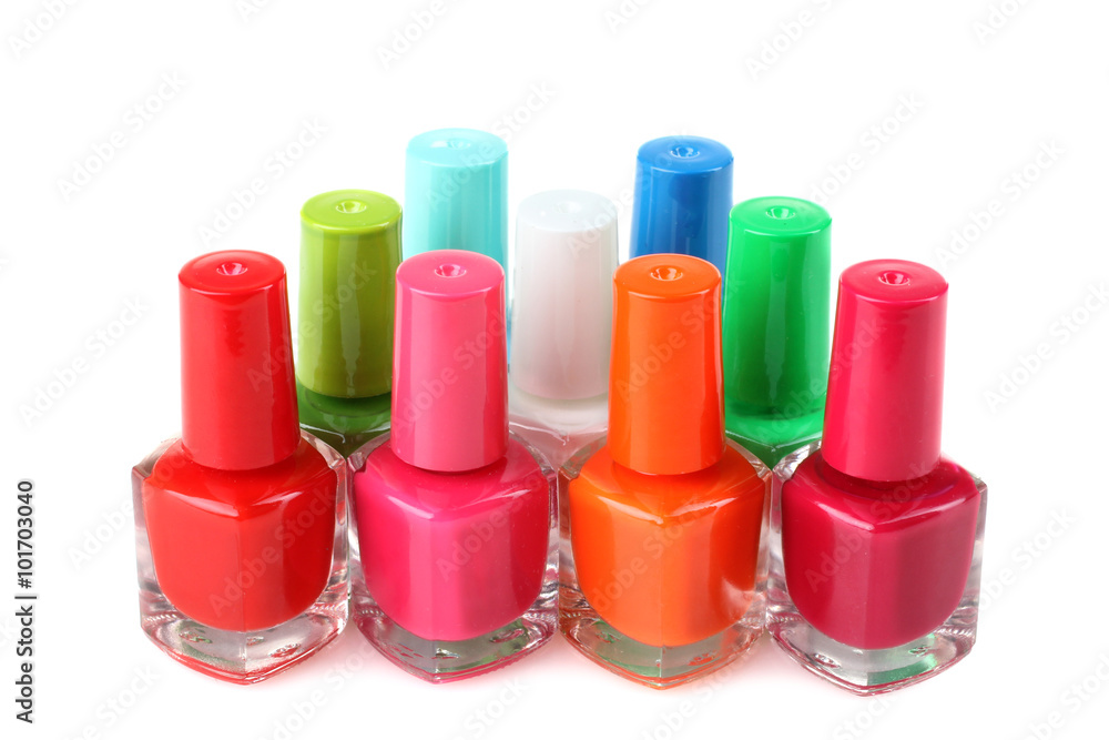 Nail Polish on white isolated background.Photo from a large number of glass bottles with colored lacquer Nail Polish on white isolated background.Photo from a large number of glass bottles with colored lacquer