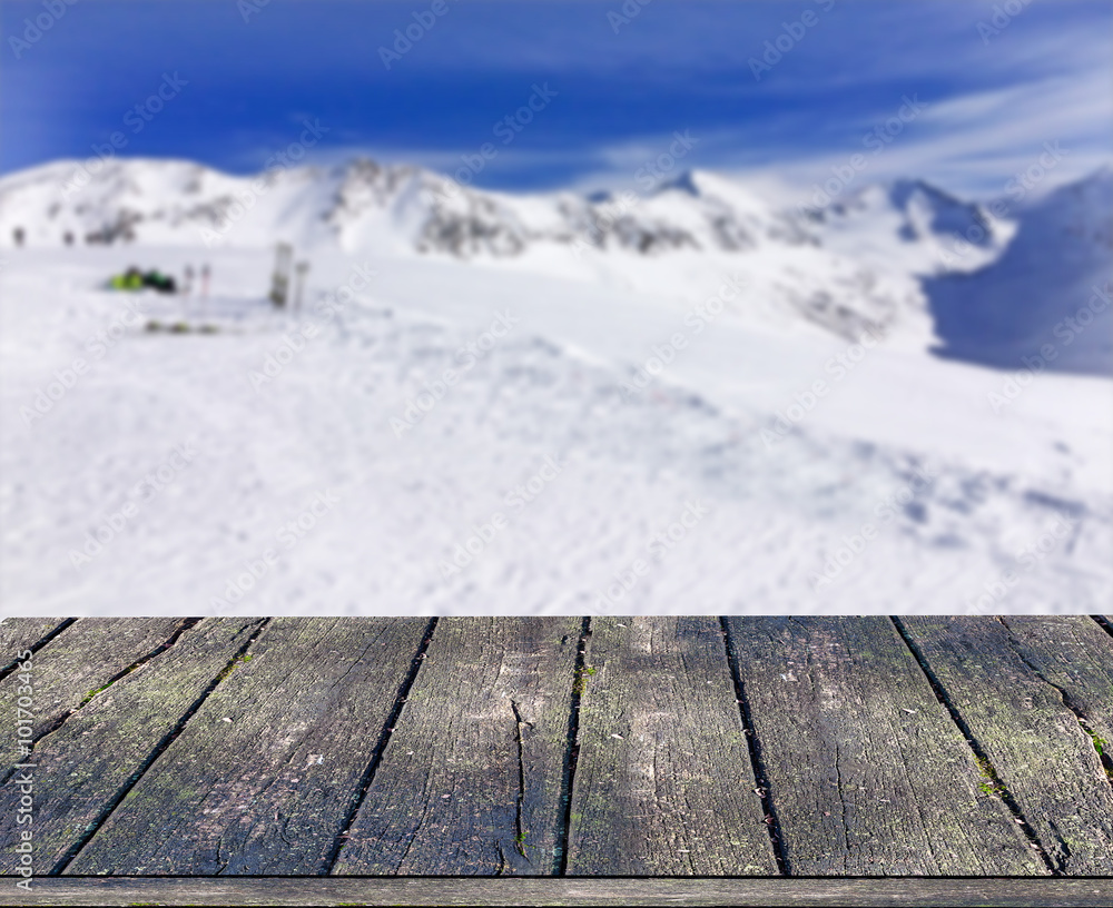 Blurred background of winter landscape with wooden deck Blurred background of winter landscape with wooden deck