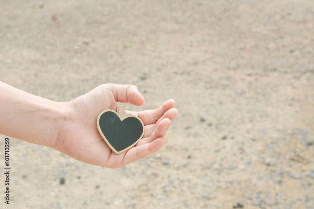 Fototapeta premium Black Heart in Hand.