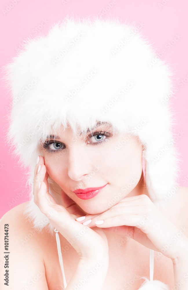 Graceful woman with perfect skin and fur hat