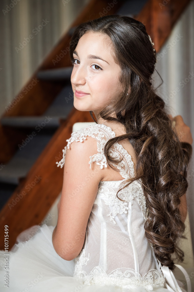 Fototapeta premium Girl dressed as a first communion at home