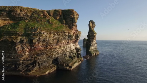 Drone shot of dramatic sea stacks at Duncansby Head near John O' Groats in Scotland
