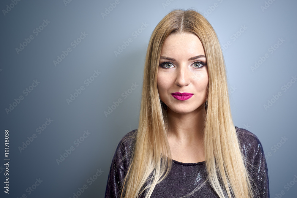 Fashion model with bright make-up. Portrait of young fashion woman with long blond hair