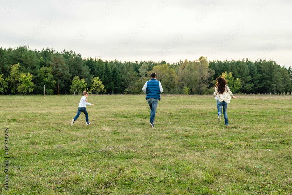 Family walking outdoors in summer
