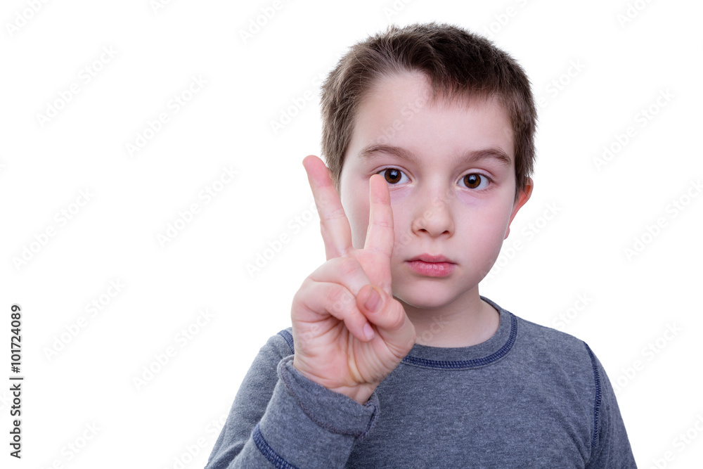 Serious boy with two fingers up Serious boy with two fingers up